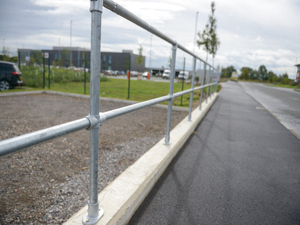 Silver Metal Key Clamp Railing in a Car Park