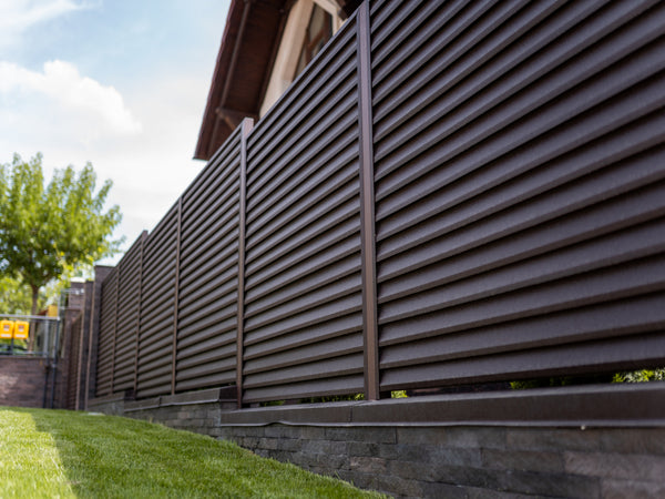 Metal Fence Panels in Brown Colour Placed Around a Property's Garden