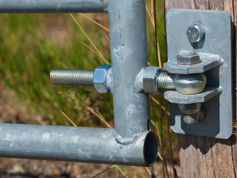 A Wrought Iron Field Gate with an Adjustable Hinge Outside