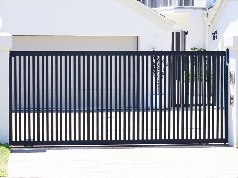 sliding gate with automation - house and garage in background